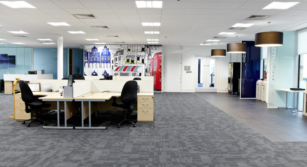 open planned office with feature wall and pendant lighting