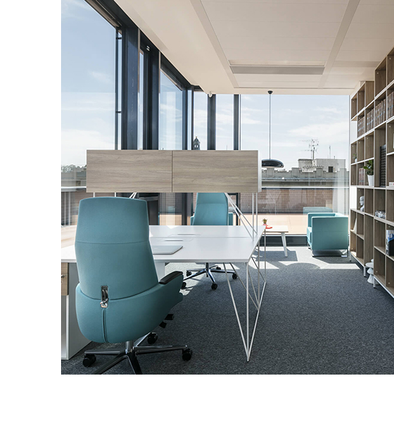 white desk with teal coloured chairs