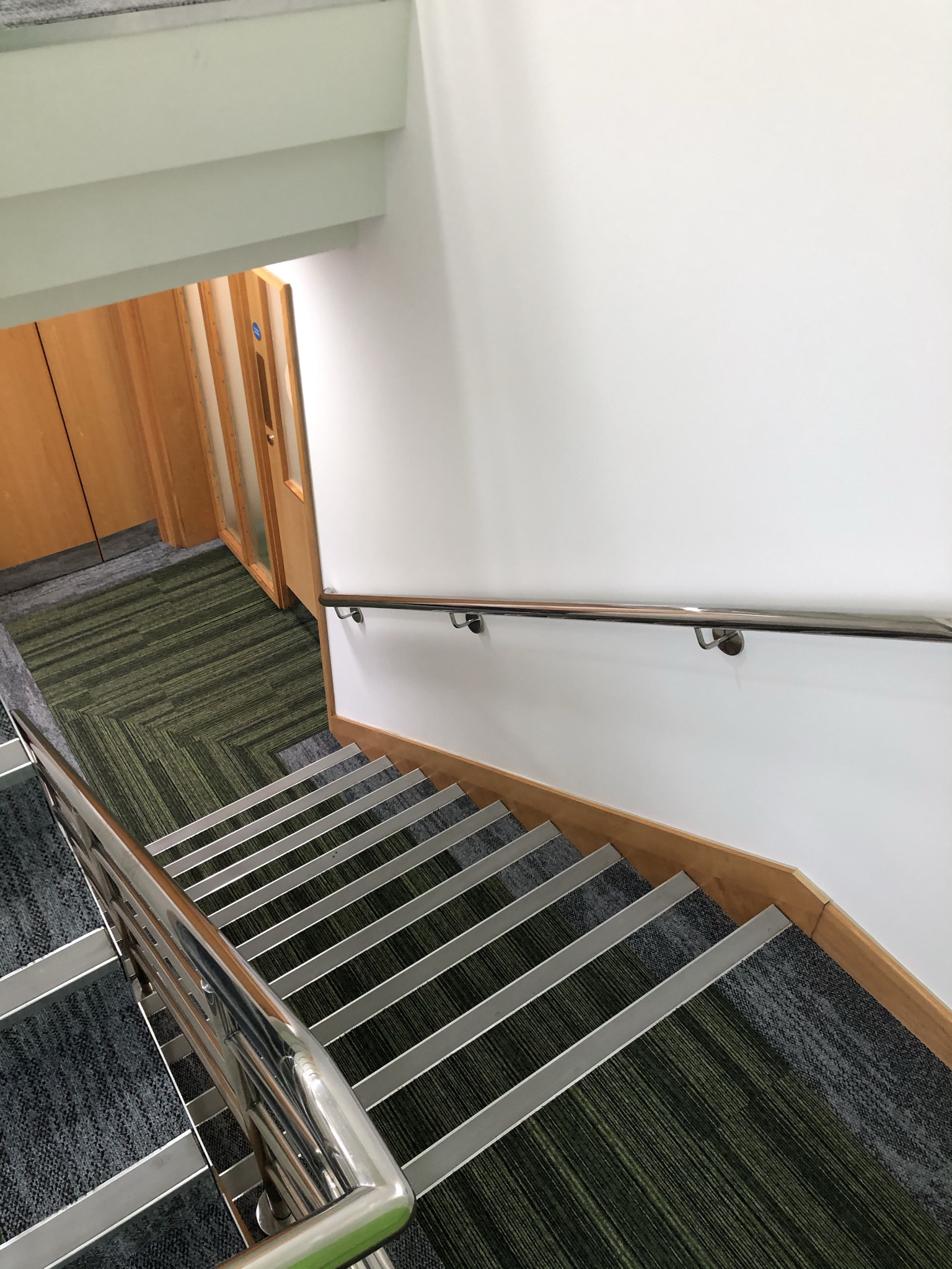 stairwell with green carpet