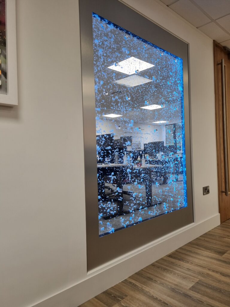 Glazed wall with bubble water feature