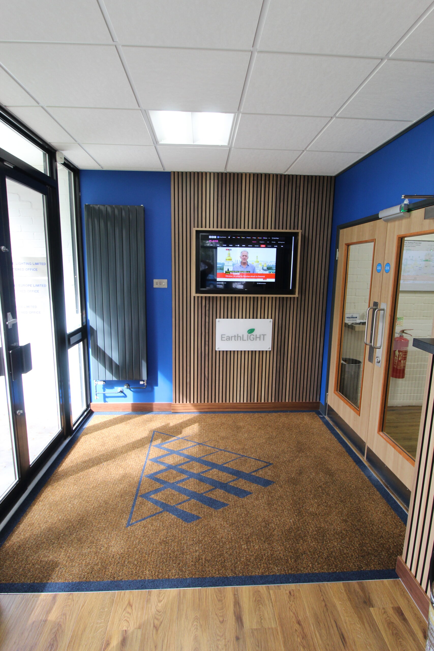 Barrier matting in front of timber feature wall