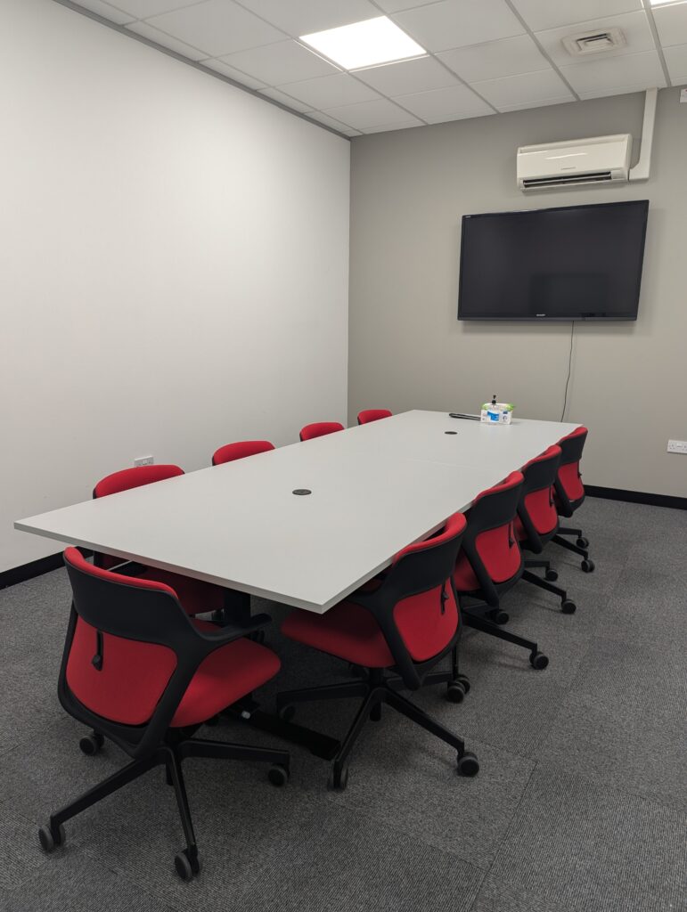 Grey table with red chairs