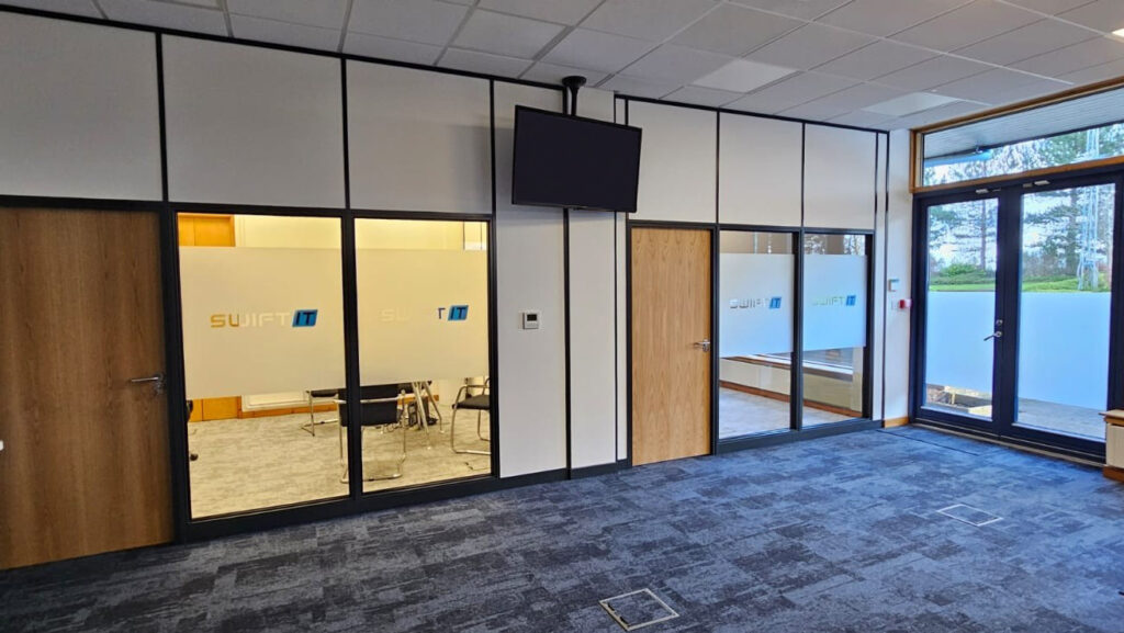 Part glazed partitioning with branded manifestations , timber doors and blur carpet tiles