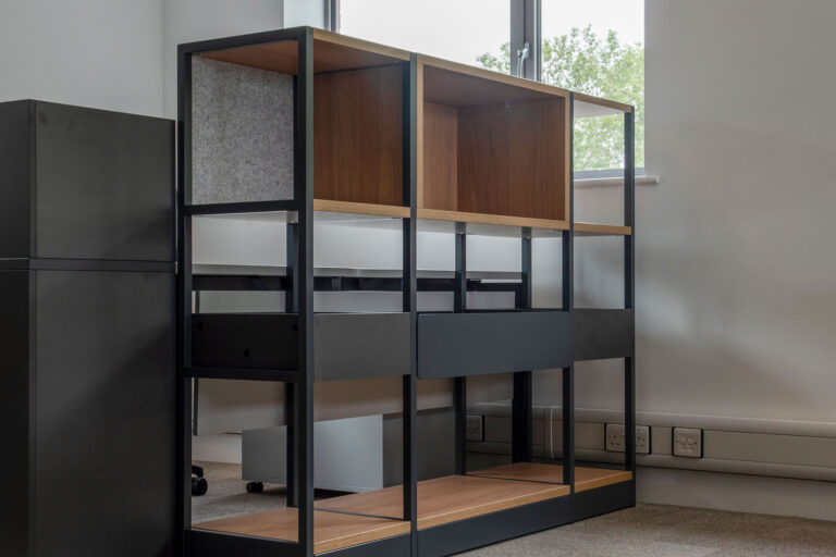 Modern shelving unit and room divider with steel mesh and felt backed shelves
