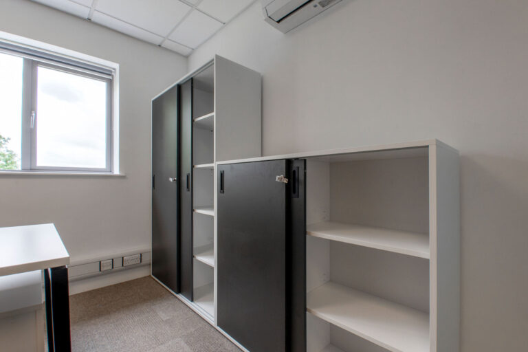 Dark grey office storage furniture with lockable sliding doors