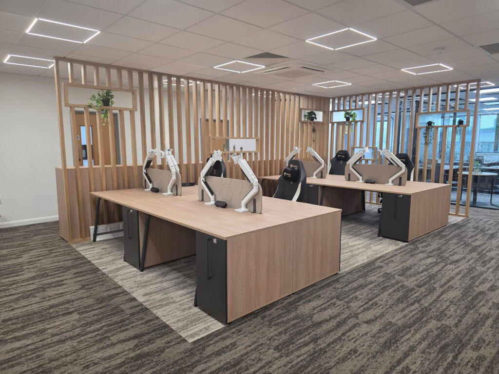 Open plan office with timber slatting to divide space.