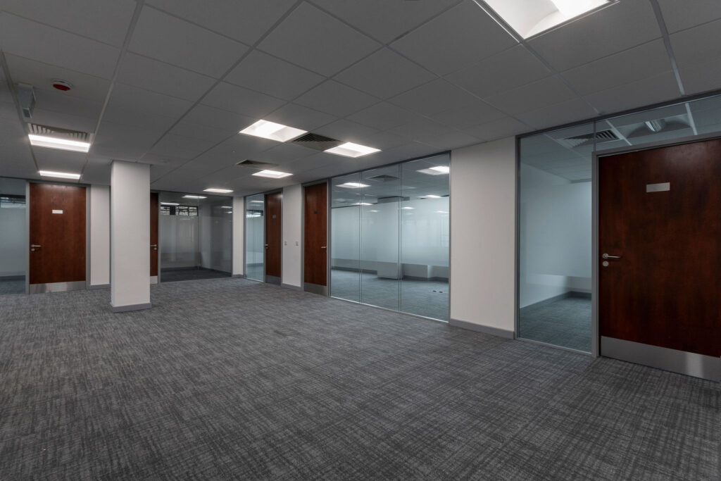 Open plan office with glazed side offices