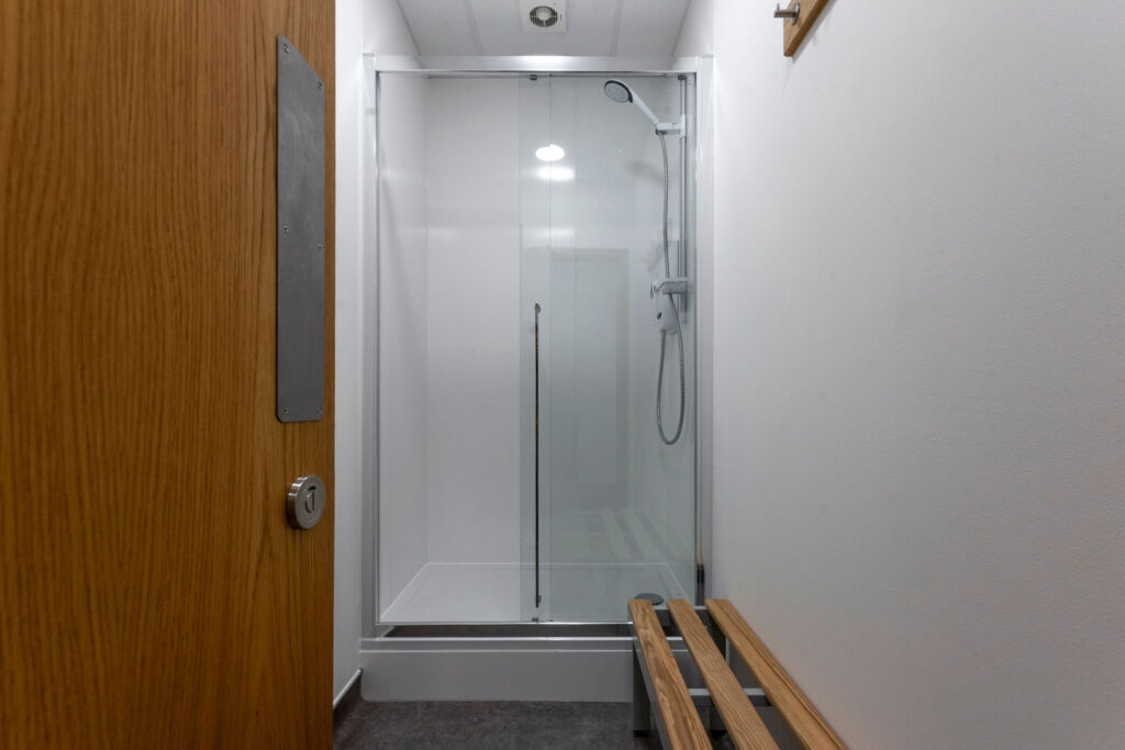 Newly installed shower with timber bench